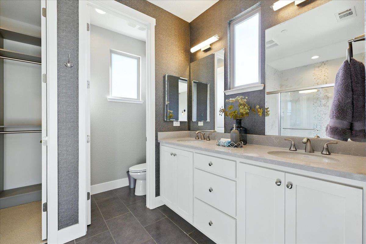 324 Cherokee Loop Mountain View, CA 94043 - Photo 36 of 62 a bathroom with a double vanity sink and a mirror