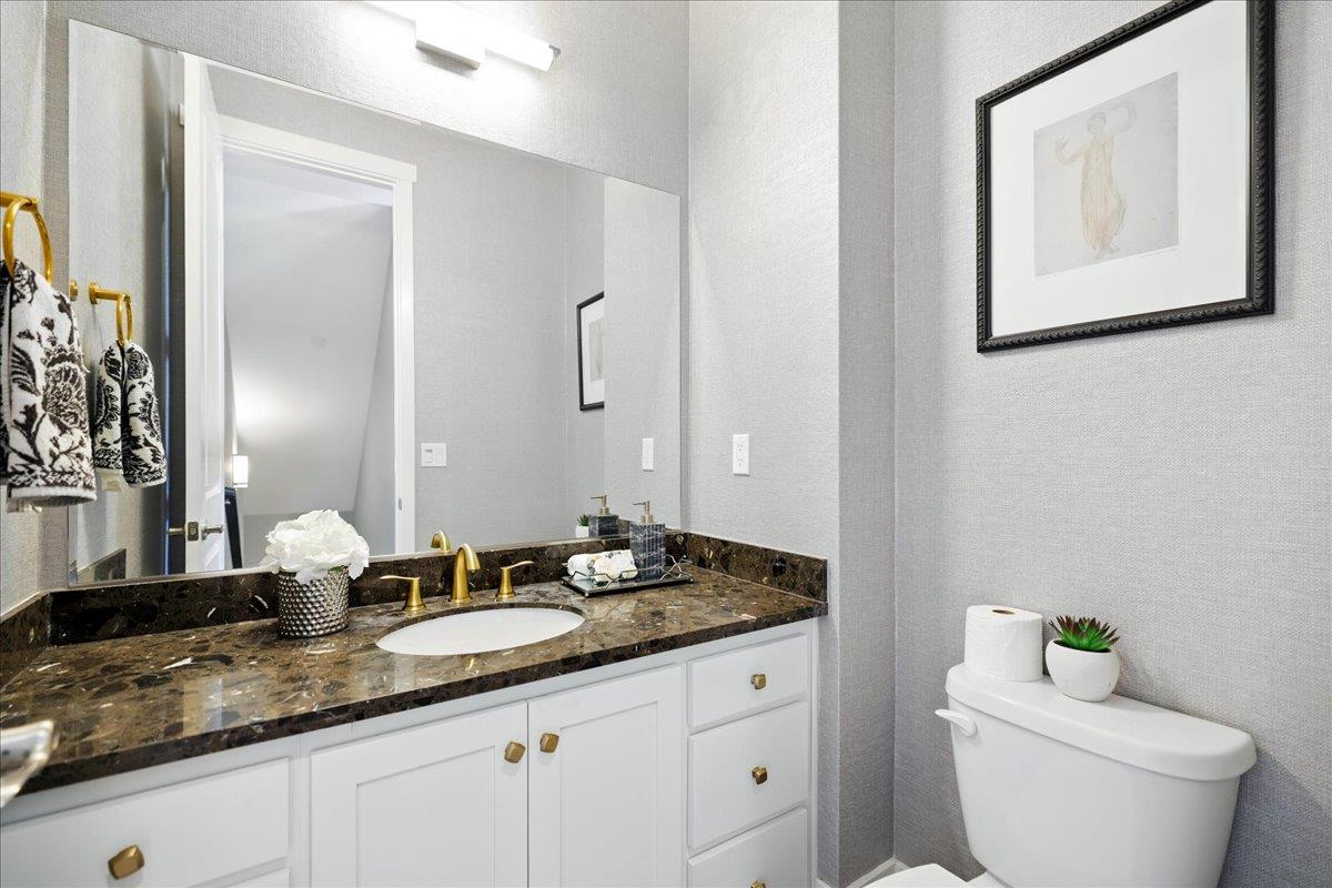 324 Cherokee Loop Mountain View, CA 94043 - Photo 45 of 62 a bathroom with a granite countertop toilet sink and mirror