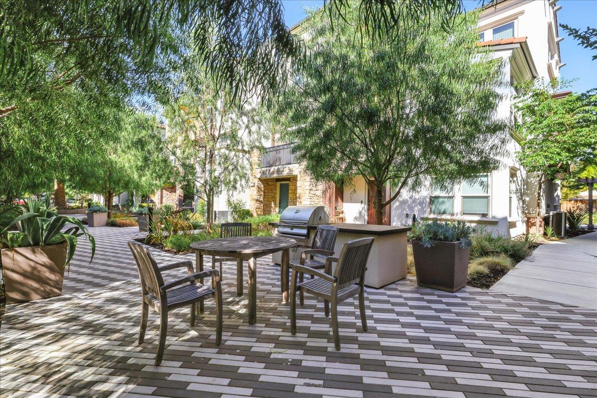 324 Cherokee Loop Mountain View, CA 94043 - Photo 50 of 62 a view of a patio with a table and chairs and potted plants
