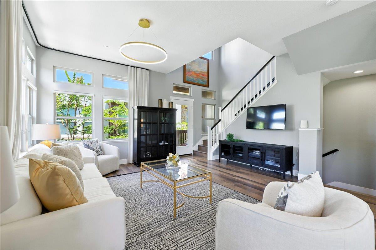324 Cherokee Loop Mountain View, CA 94043 - Photo 5 of 62 a living room with furniture a fireplace and a large window