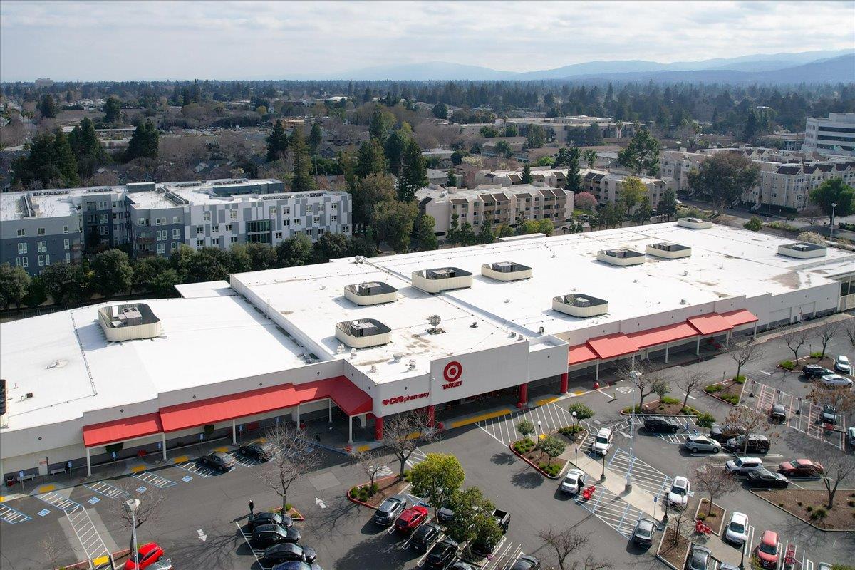 324 Cherokee Loop Mountain View, CA 94043 - Photo 56 of 62 a view of a terrace with a table and chairs under an umbrella