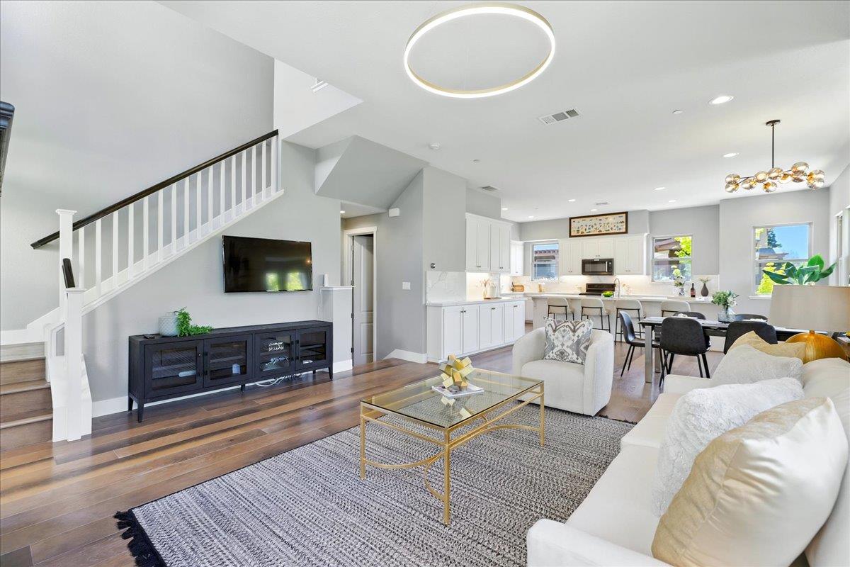324 Cherokee Loop Mountain View, CA 94043 - Photo 9 of 62 a living room with furniture a flat screen tv and kitchen view