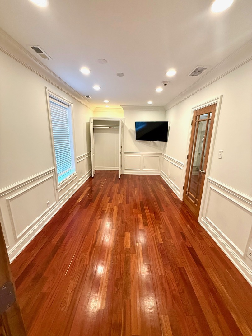 1000 Ridge Road, Unit 2 Wilmette, IL 60091 - Photo 6 of 11 a view of empty room with wooden floor