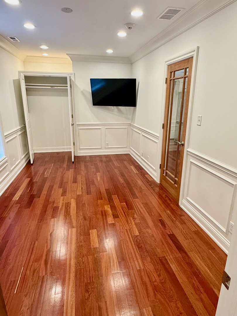 1000 Ridge Road, Unit 2 Wilmette, IL 60091 - Photo 7 of 11 wooden floor in an empty room with wooden floor