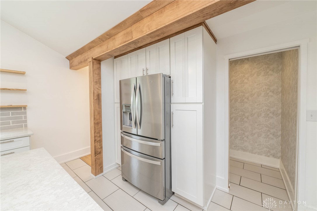 190 Swailes Road Troy, OH 45373 - Photo 10 of 82 This modern kitchen features stylish exposed beams and sleek stainless steel appliances.