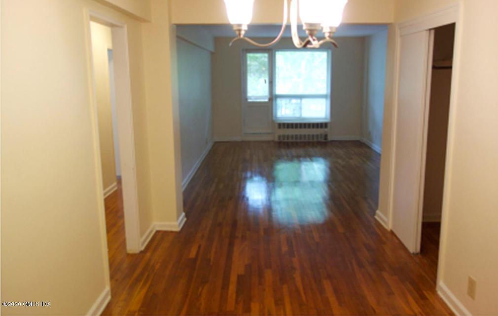 30 Brookside Drive, Unit 4C Greenwich, CT 06830 - Photo 3 of 9 Dining Room to Living Room