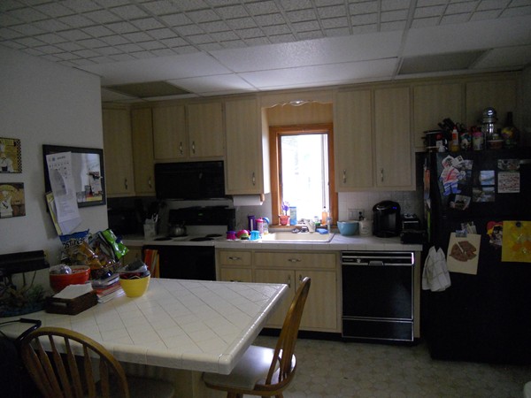 52 Malvern Road Brockton, MA 02301 - Photo 2 of 8 a kitchen with a sink a stove and chairs