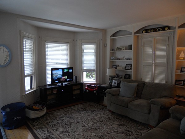 52 Malvern Road Brockton, MA 02301 - Photo 4 of 8 a living room with furniture fireplace and a window