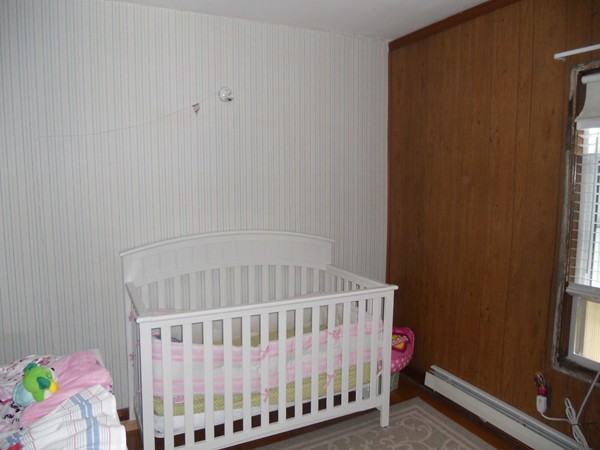 52 Malvern Road Brockton, MA 02301 - Photo 6 of 8 a bedroom with a bed and a window