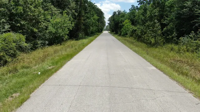 a view of a road with a yard