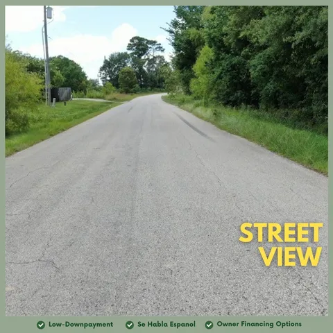 a view of a street with a park