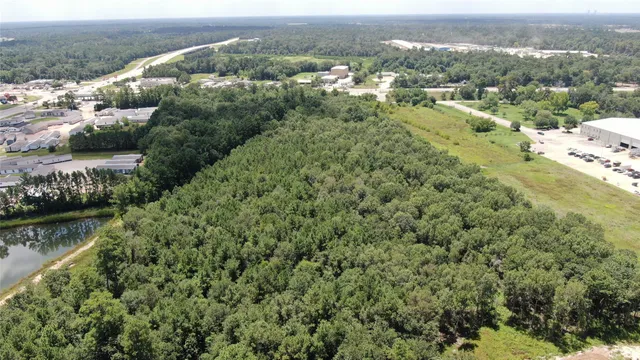 an aerial view of a house with a lake view