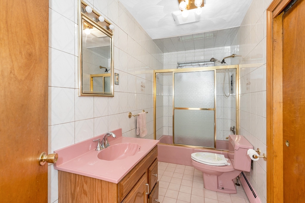 303 Walnut Street Saugus, MA 01906 - Photo 14 of 41 a bathroom with a sink and a mirror