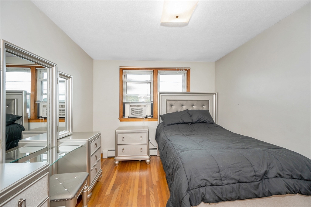 303 Walnut Street Saugus, MA 01906 - Photo 15 of 41 a bedroom with a bed and a large window