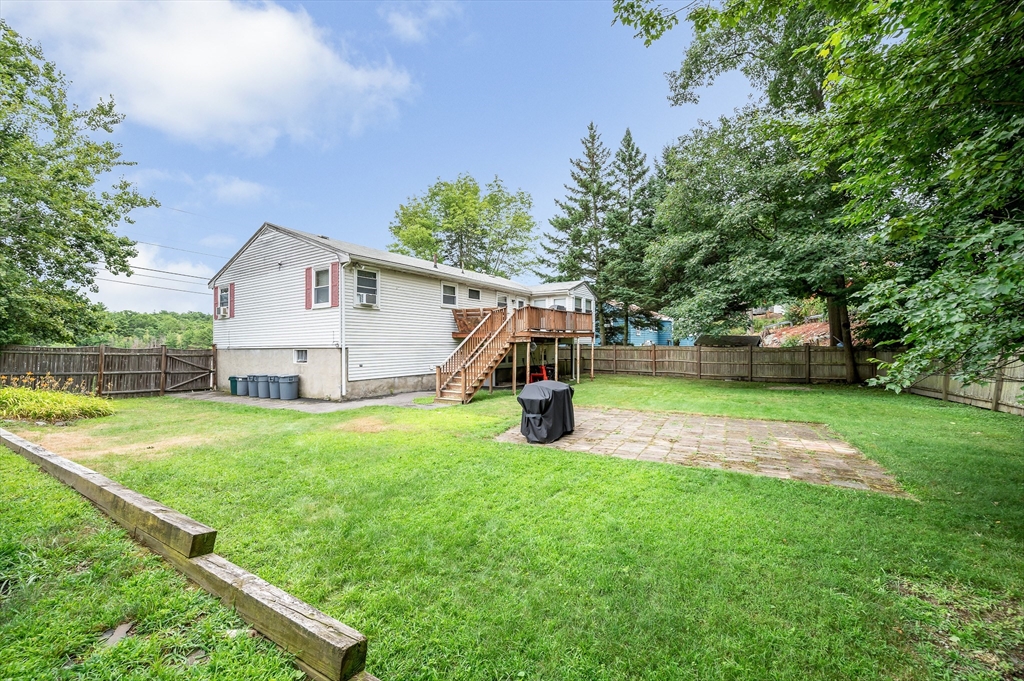 303 Walnut Street Saugus, MA 01906 - Photo 30 of 41 a front view of house with yard and trees