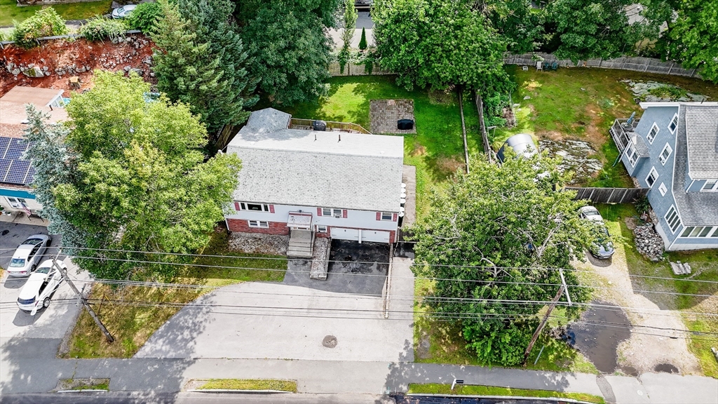 303 Walnut Street Saugus, MA 01906 - Photo 38 of 41 an aerial view of a house with garden space and a car park in back