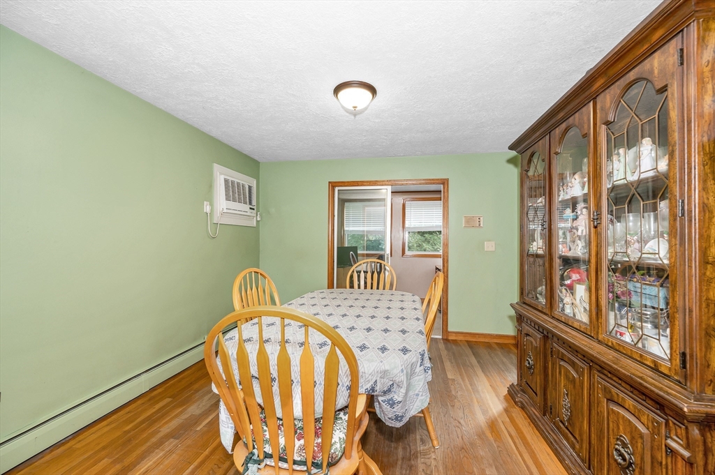 303 Walnut Street Saugus, MA 01906 - Photo 6 of 41 a view of a bedroom with wooden floor and windows