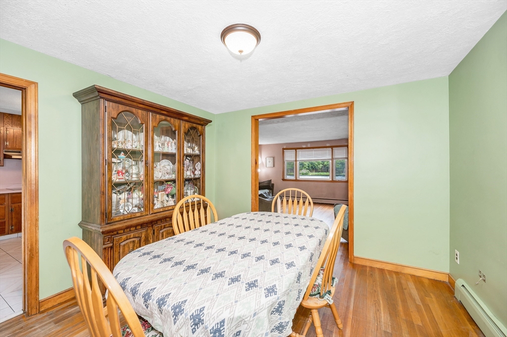 303 Walnut Street Saugus, MA 01906 - Photo 8 of 41 a bedroom with a bed and wooden floor