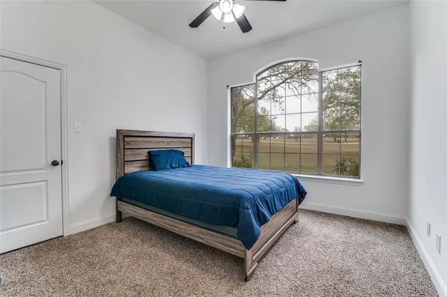 a bed sitting in a room next to a window