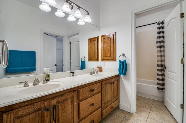 a bathroom with a sink double vanity and a mirror
