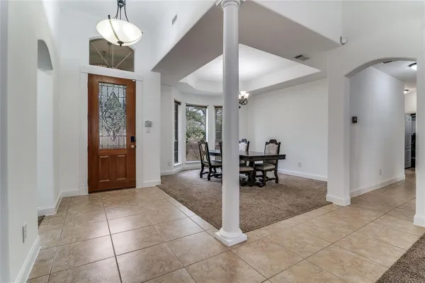 a view interior of a house and livingroom with furniture wooden floor and a ceiling fan