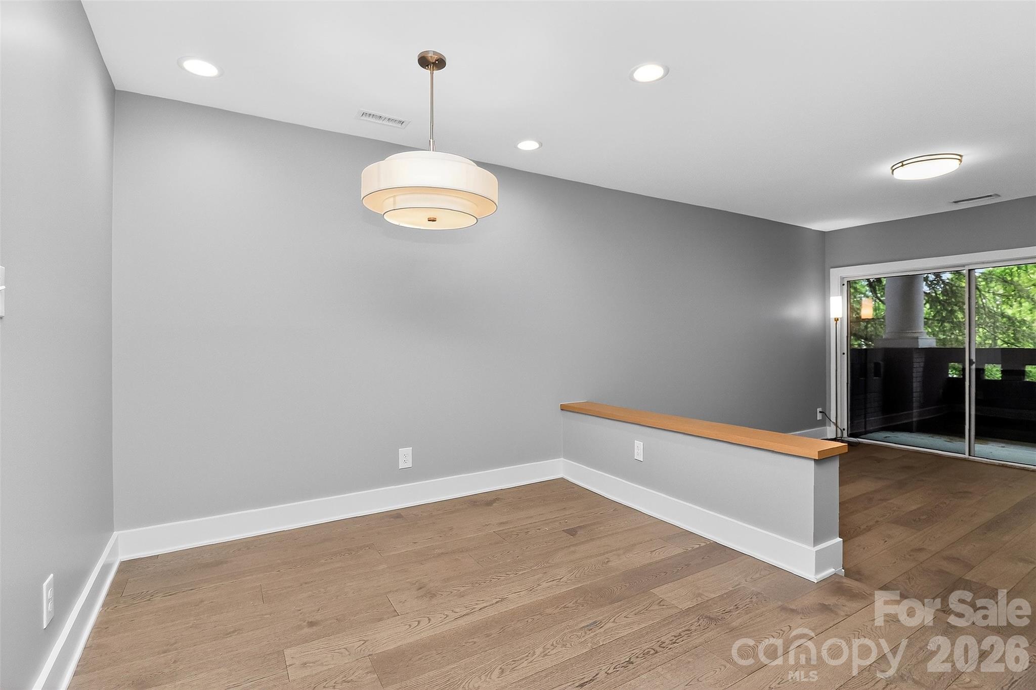 603 Queens Road, Unit B Charlotte, NC 28207 - Photo 12 of 33 a view of an empty room with a window