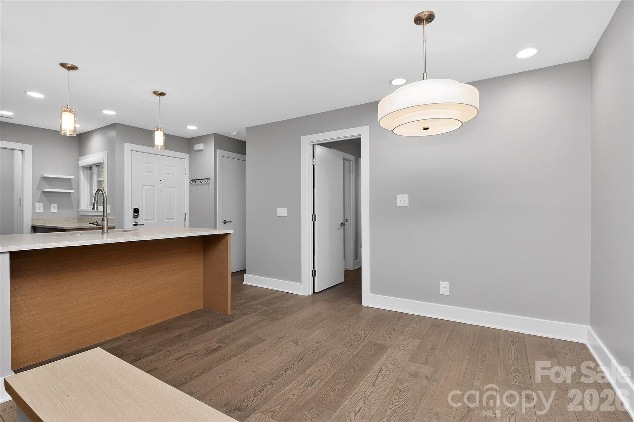 603 Queens Road, Unit B Charlotte, NC 28207 - Photo 13 of 33 a view of kitchen with wooden floor and window