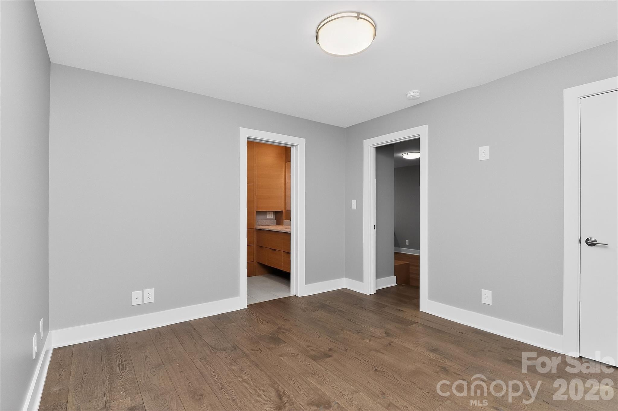 603 Queens Road, Unit B Charlotte, NC 28207 - Photo 19 of 33 an empty room with closet and a bathroom