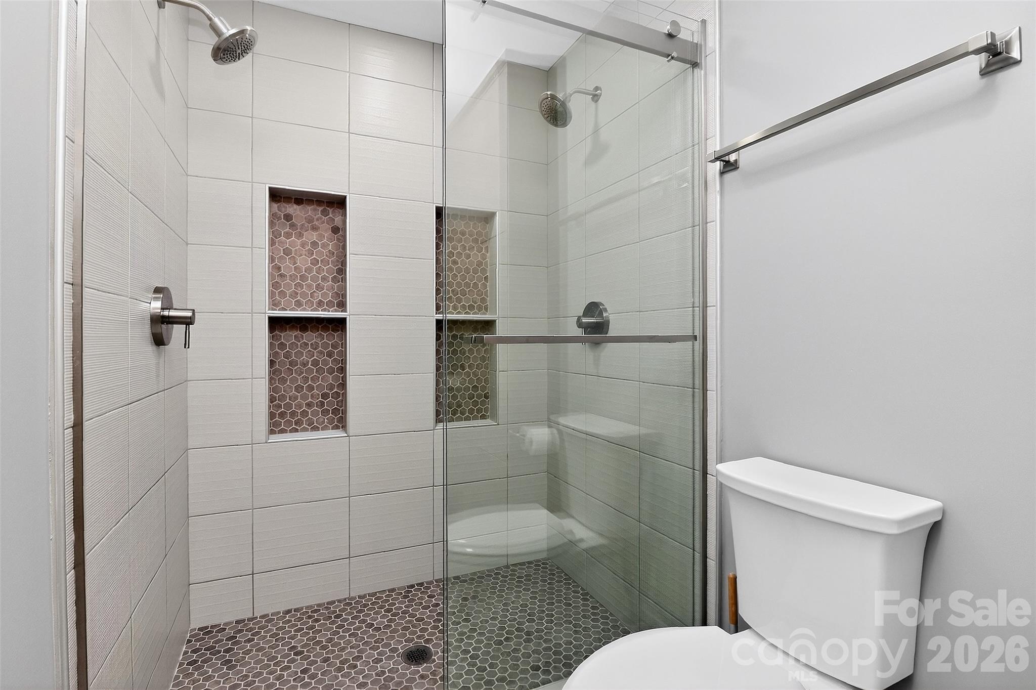 603 Queens Road, Unit B Charlotte, NC 28207 - Photo 23 of 33 a bathroom with a toilet and shower