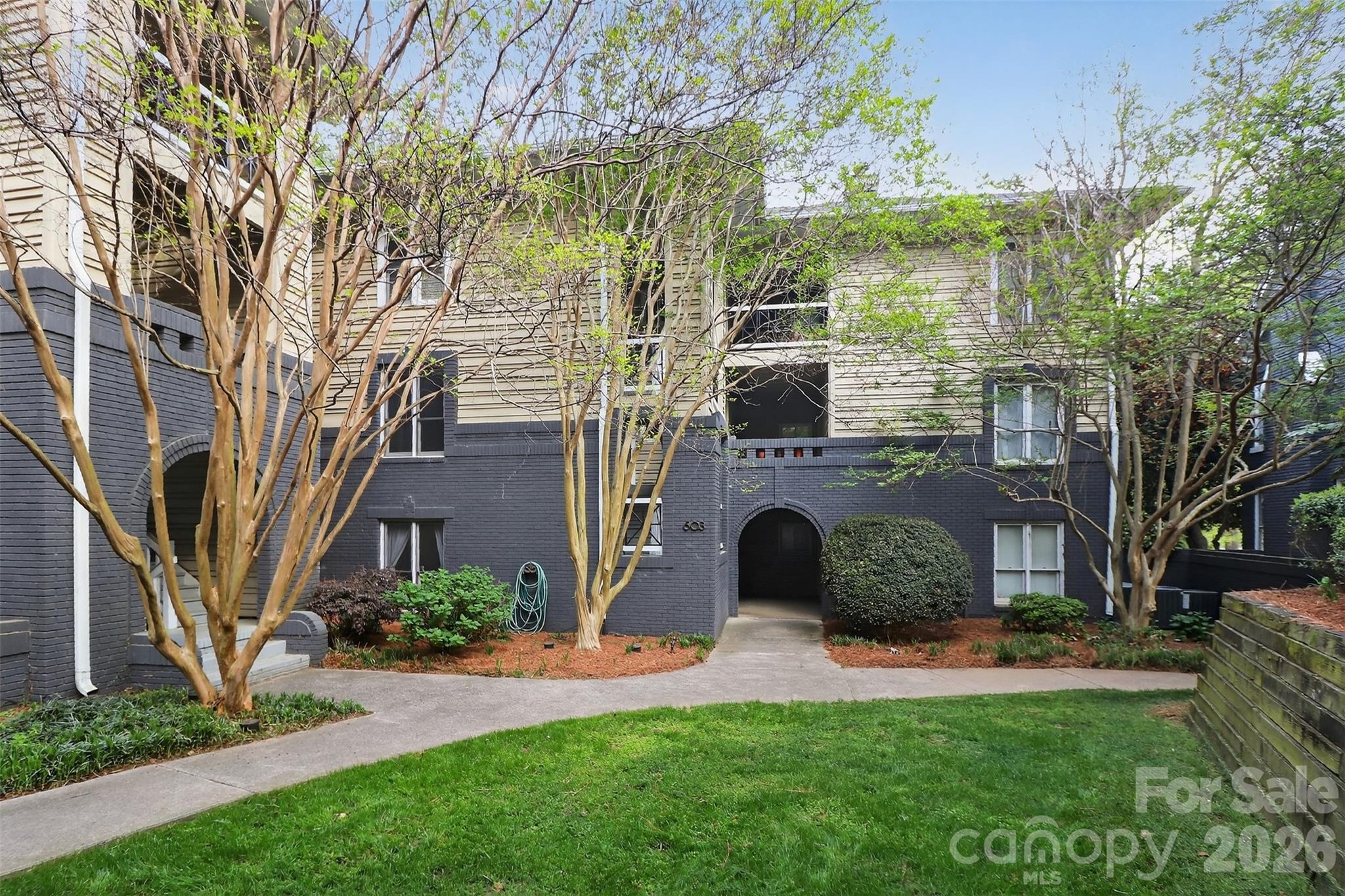 603 Queens Road, Unit B Charlotte, NC 28207 - Photo 31 of 33 a view of a front of a house with a yard and large tree