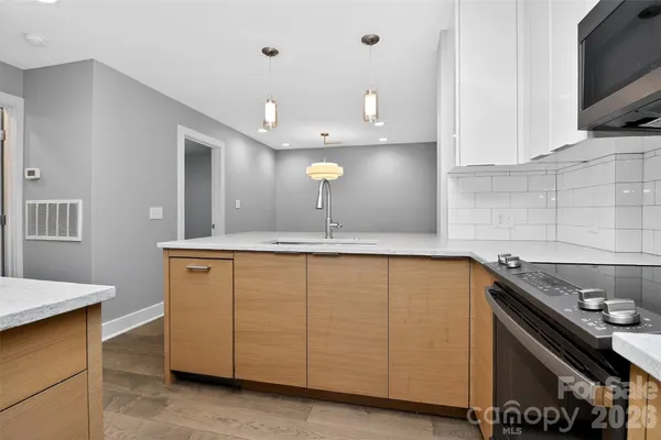 a kitchen with a sink and cabinets