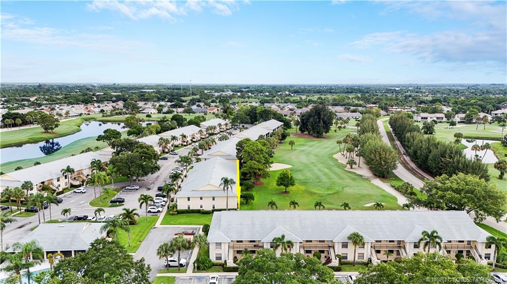 1001 Keystone Drive, Unit A Jupiter, FL 33458 - Photo 27 of 30 an aerial view of a city with lots of residential buildings and mountain view in back