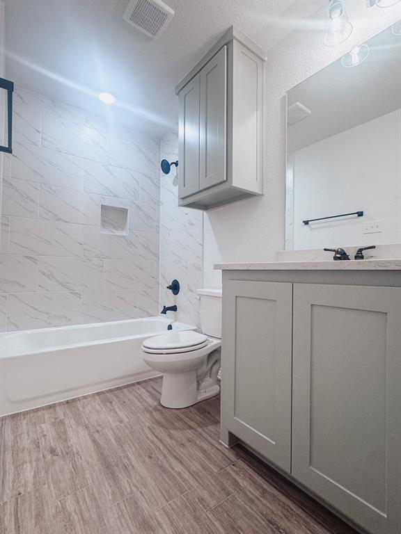 1008 East Bradshaw Road Springtown, TX 76082 - Photo 6 of 8 a bathroom with a sink a toilet and bathtub