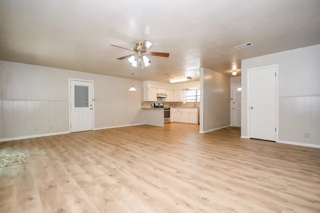 a view of a livingroom with a kitchen