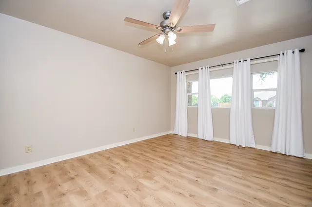 a view of an empty room with a window