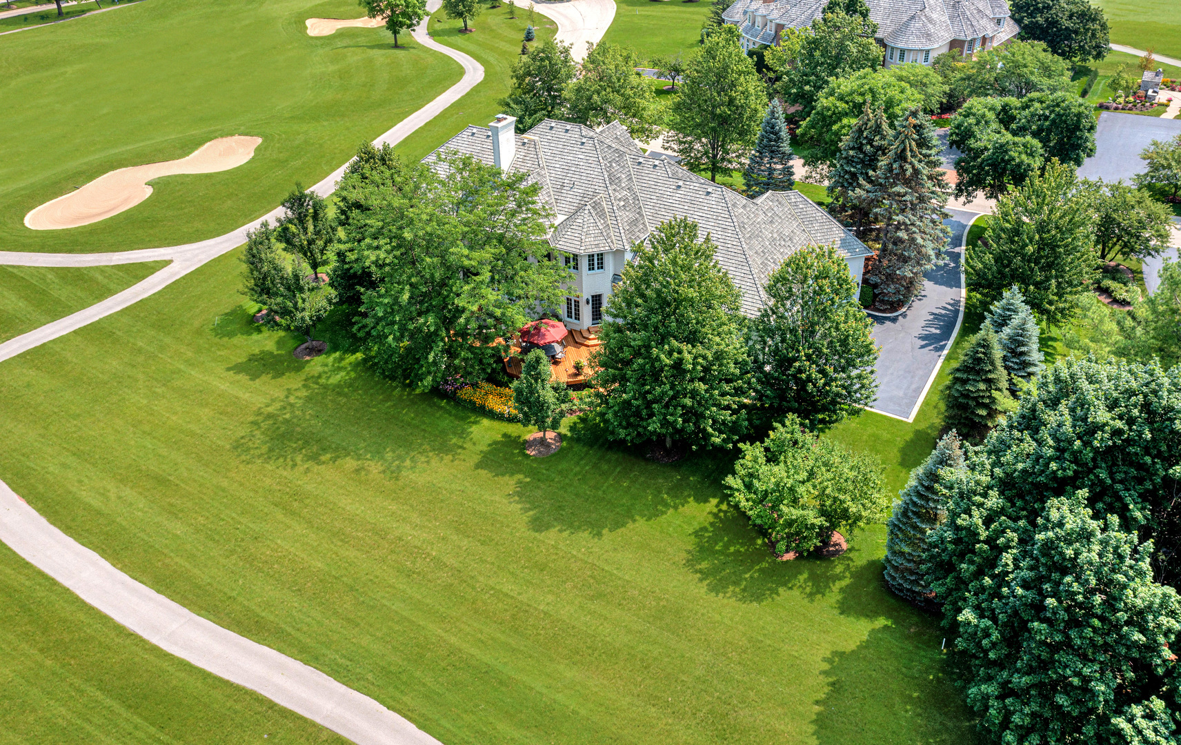 4454 Kettering Drive Long Grove, IL 60047 - Photo 43 of 49 a view of a lake with a house
