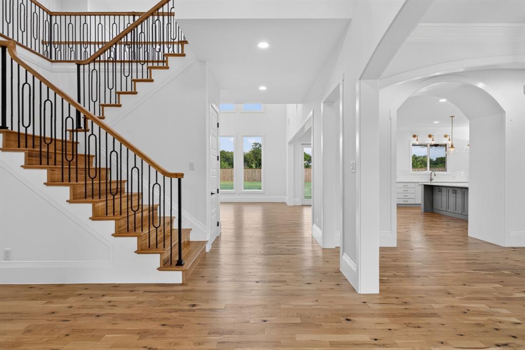 7798 Barber Rnch Road Fort Worth, TX 76126 - Photo 4 of 40 a view of an entryway with wooden floor and a front door