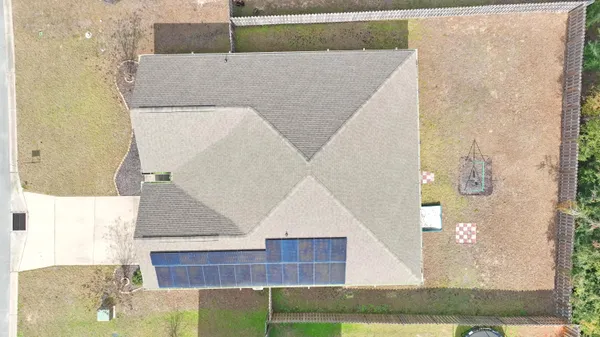 a kitchen with a sink stove top oven and wooden floor