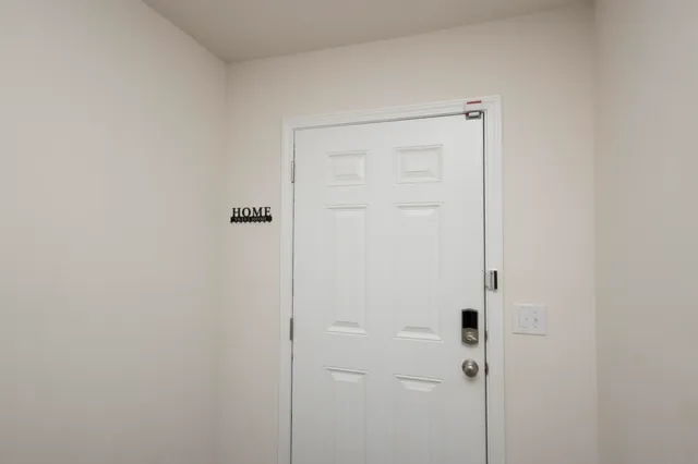 a kitchen with stainless steel appliances granite countertop a sink stove and microwave