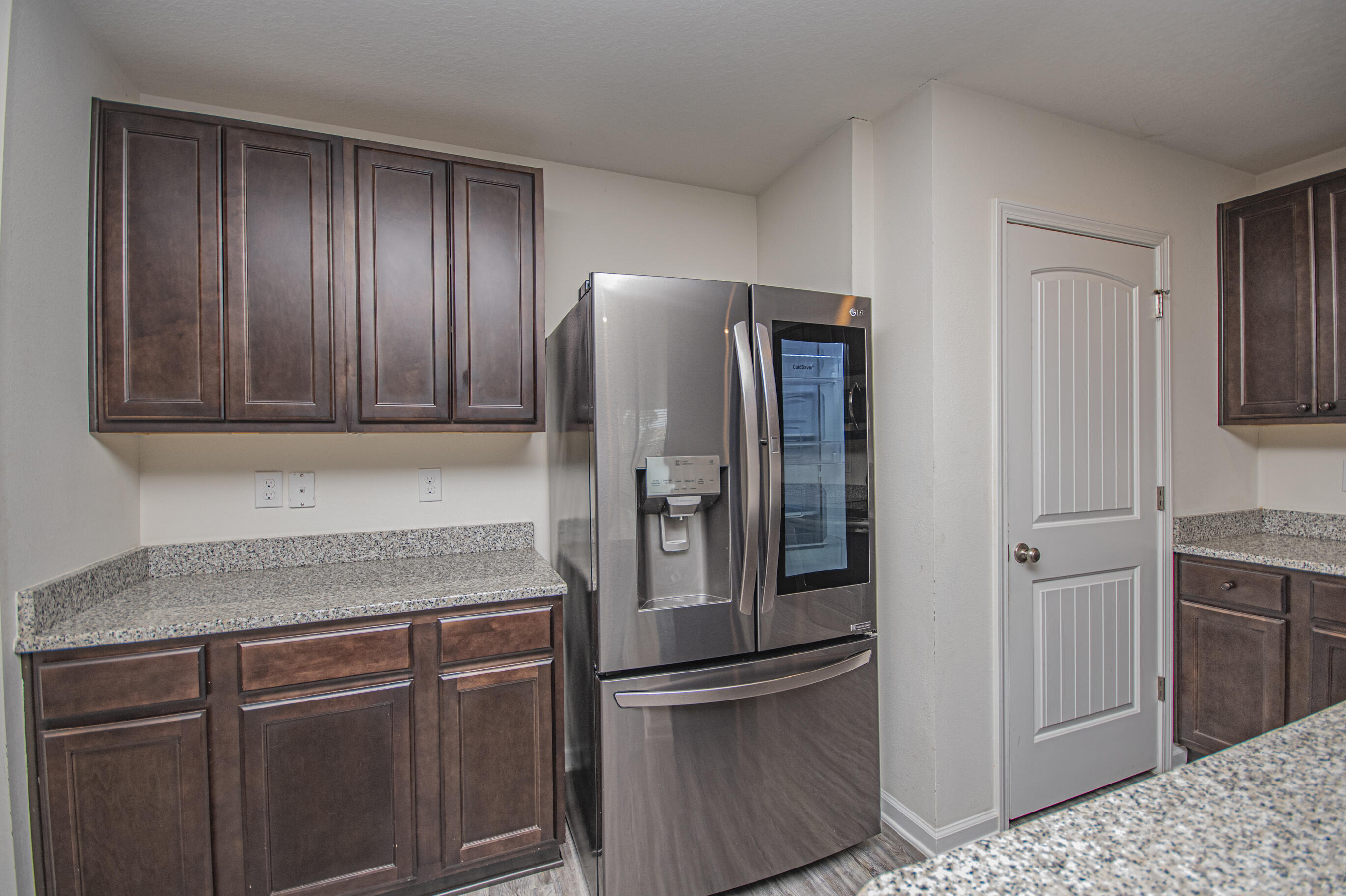 356 Merlin Court Crestview, FL 32539 - Photo 25 of 70 a kitchen with stainless steel appliances granite countertop a refrigerator and a sink