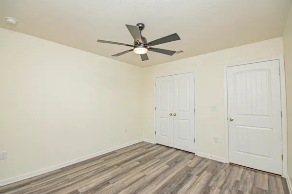 a bathroom with a shower and a glass door