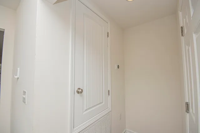 a view of a brick house with a large window