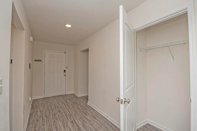 a view of an empty room with white walls