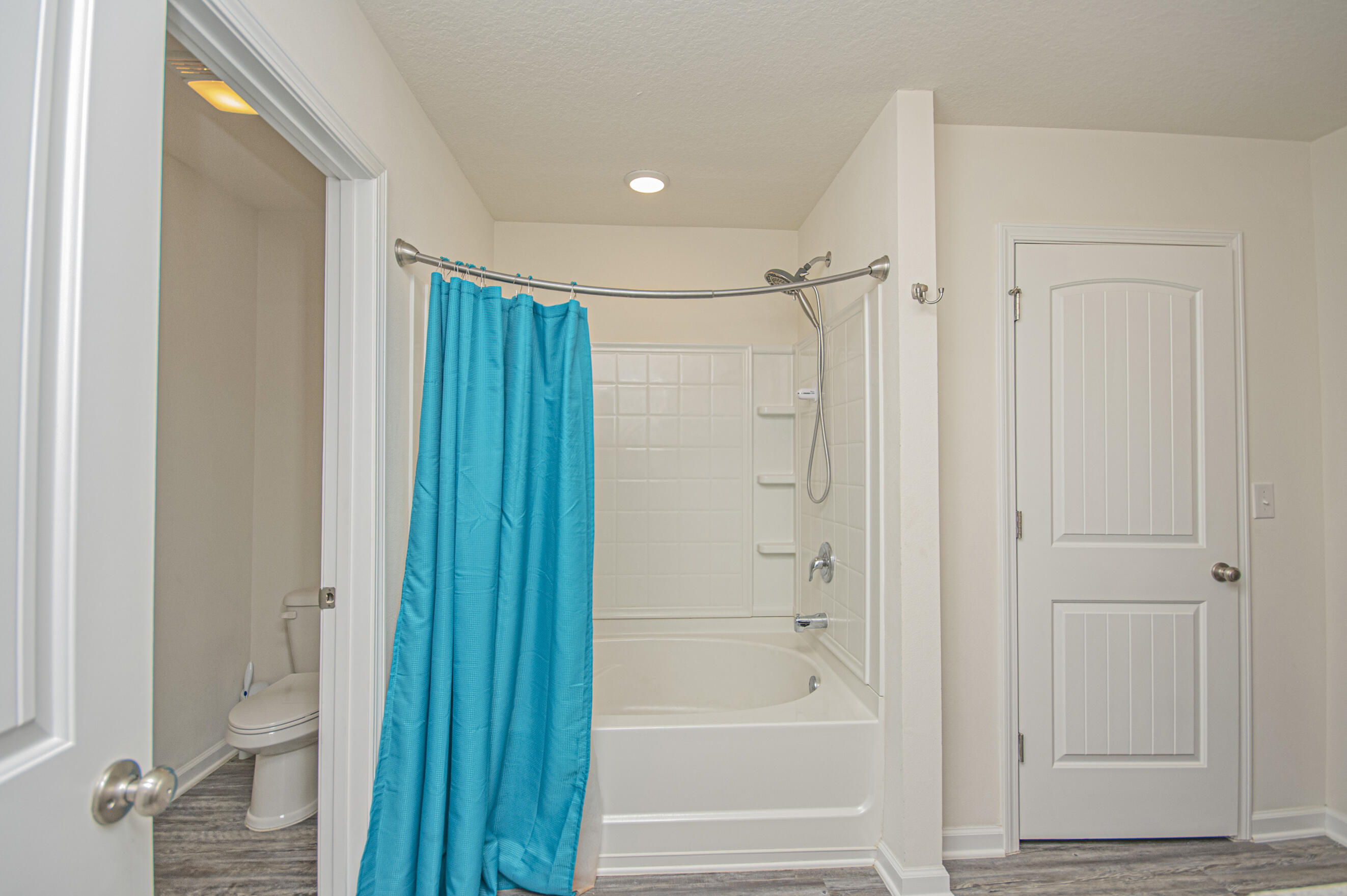 356 Merlin Court Crestview, FL 32539 - Photo 42 of 70 a bathroom with a shower and a glass door