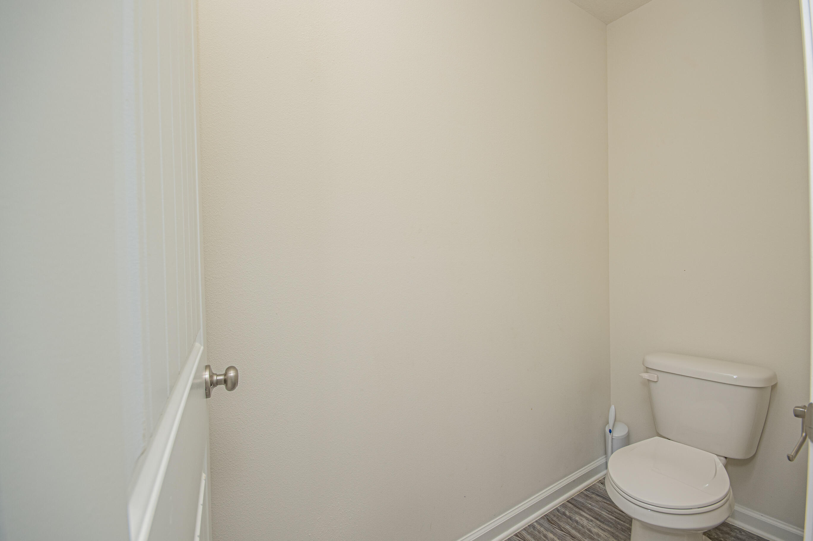 356 Merlin Court Crestview, FL 32539 - Photo 44 of 70 a white toilet sitting next to a white wall