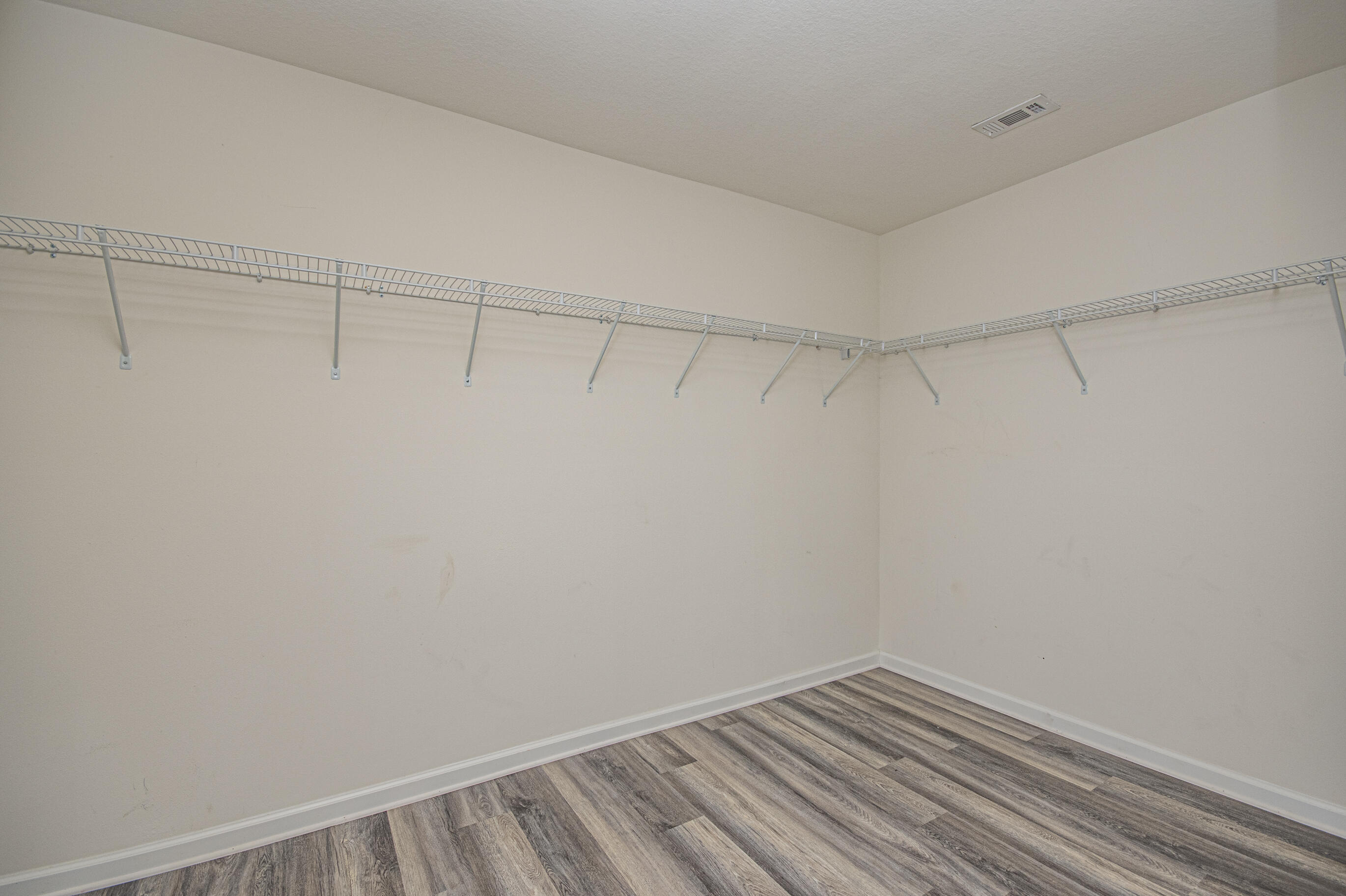 356 Merlin Court Crestview, FL 32539 - Photo 46 of 70 a view of a room with racks on the wall