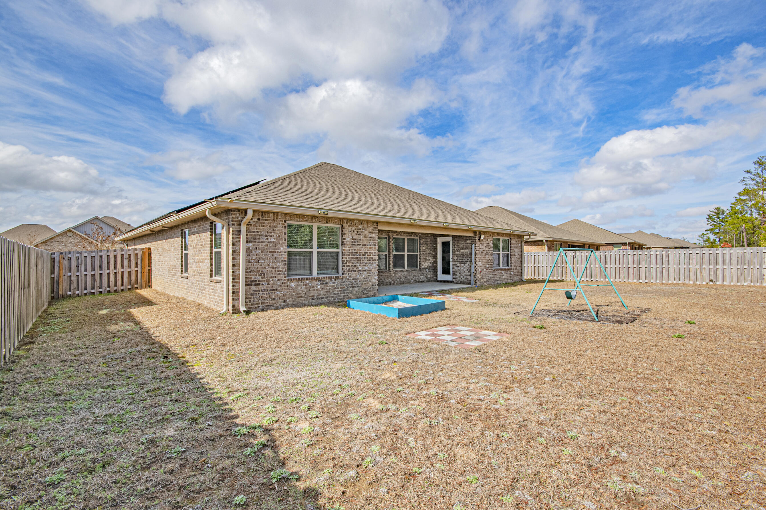 356 Merlin Court Crestview, FL 32539 - Photo 56 of 70 a view of a house with a yard and sitting area