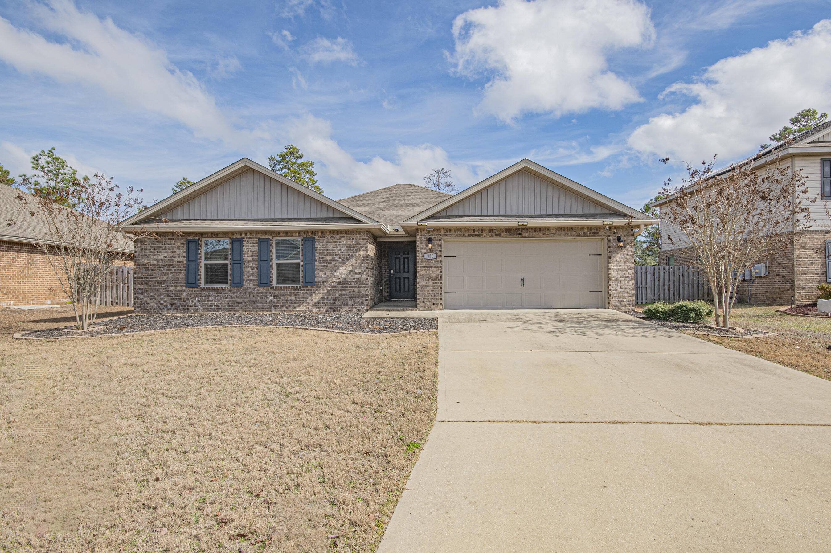 356 Merlin Court Crestview, FL 32539 - Photo 60 of 70 a front view of a house with a yard and garage
