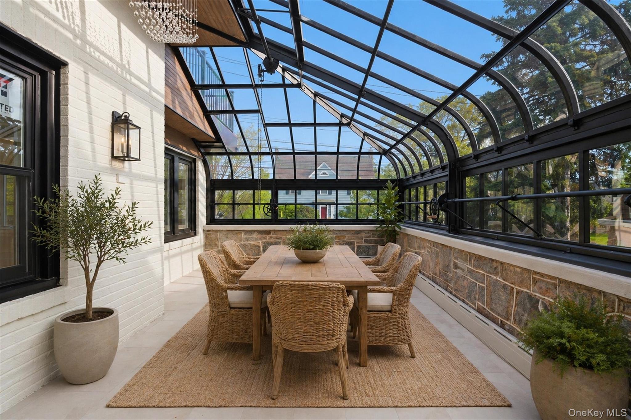 40 Calhoun Avenue New Rochelle, NY 10801 - Photo 16 of 49 Enclosed sunroom featuring a vaulted glass ceiling and black metal framing