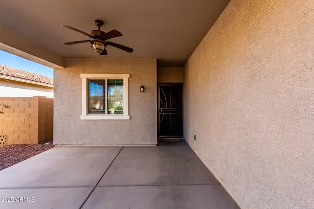a view of livingroom with a ceiling fan and window
